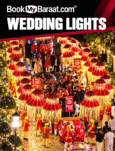 Book My Baraat illuminated red umbrellas and golden lights in a wedding procession
